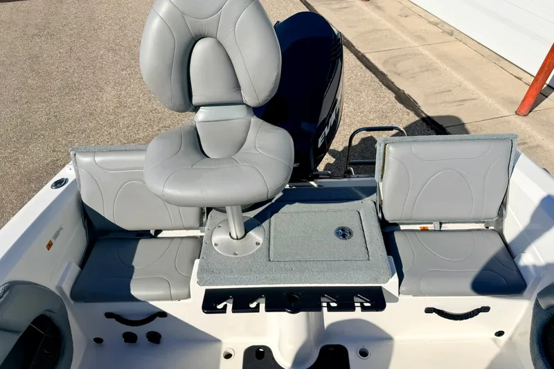 Slide: The Image of 2007 Stratos 375 XF boat interior with gray seating and storage compartments. - 29