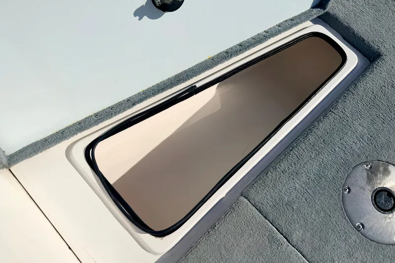 Slide: The Image of Open storage compartment on 2007 Stratos 375 XF boat deck. - 61