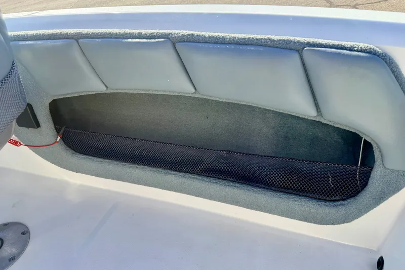 Slide: The Image of Interior storage compartment of a 2007 Stratos 375 XF boat with padded lining. - 79