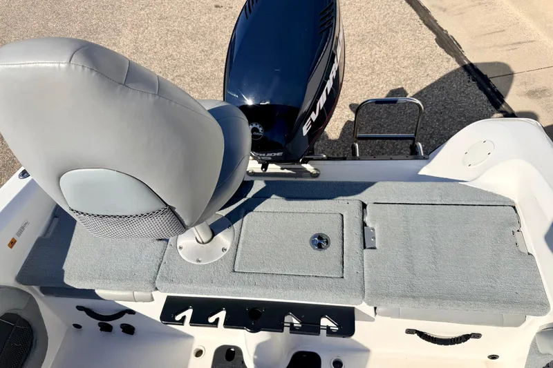 Slide: The Image of 2007 Stratos 375 XF boat interior with seat and Evinrude motor. - 22
