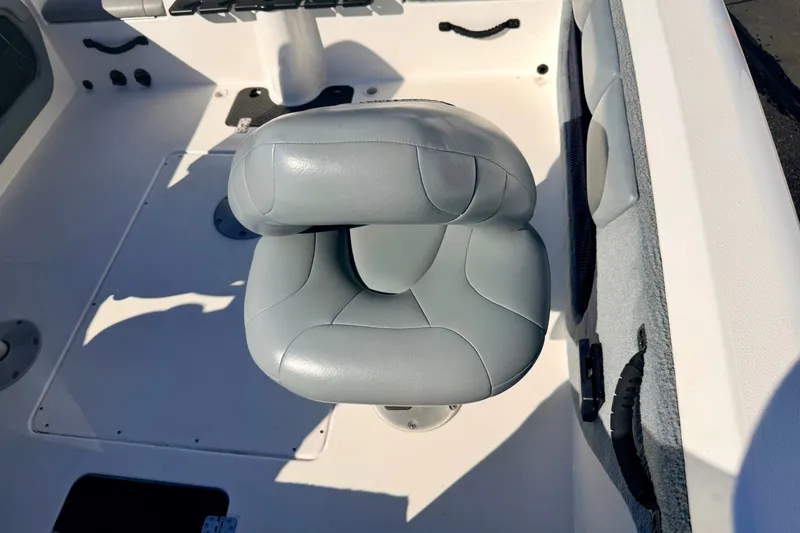 Slide: The Image of Gray cushioned seat in 2007 Stratos 375 XF boat interior. - 51