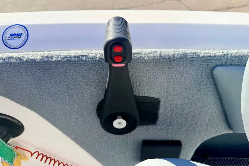 Slide: The Image of Throttle control lever on a 2007 Stratos 375 XF boat interior. - 48
