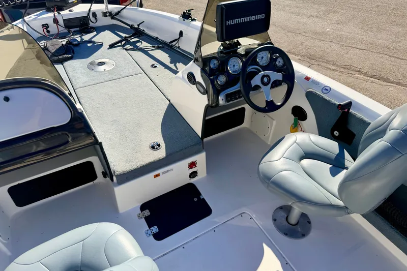 Slide: The Image of Interior of 2007 Stratos 375 XF boat with steering wheel and seating. - 78