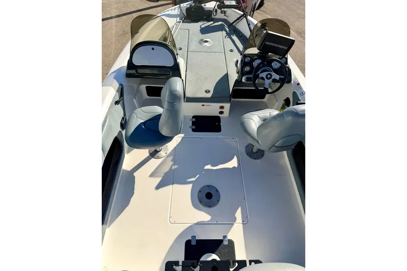 Slide: The Image of 2007 Stratos 375 XF boat interior with dual seats and steering console. - 35
