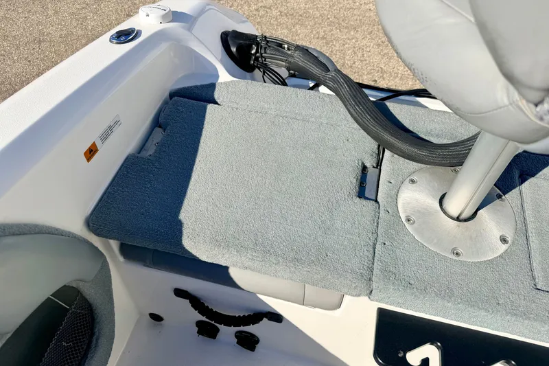 Slide: The Image of Interior of 2007 Stratos 375 XF boat with gray carpeted seating and mounted seat. - 25