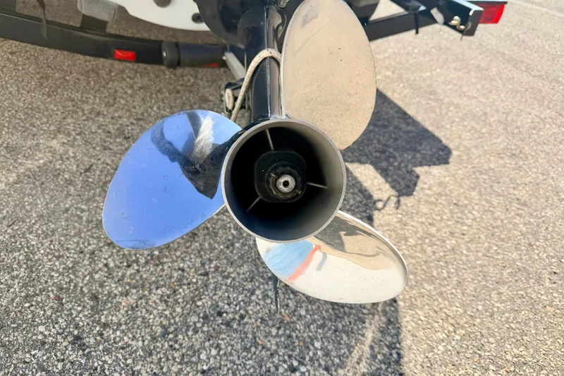 Slide: The Image of Propeller of a 2007 Stratos 375 XF boat on a trailer, close-up view. - 19