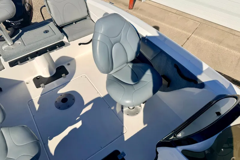 Slide: The Image of Interior of a 2007 Stratos 375 XF boat with gray seating and console. - 76