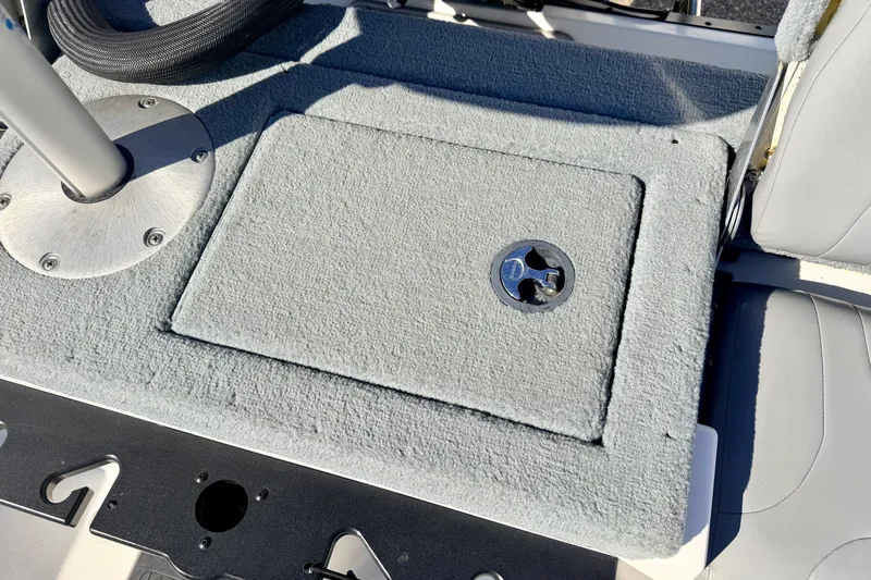 Slide: The Image of 2007 Stratos 375 XF boat deck with carpeted storage compartment and seat. - 30