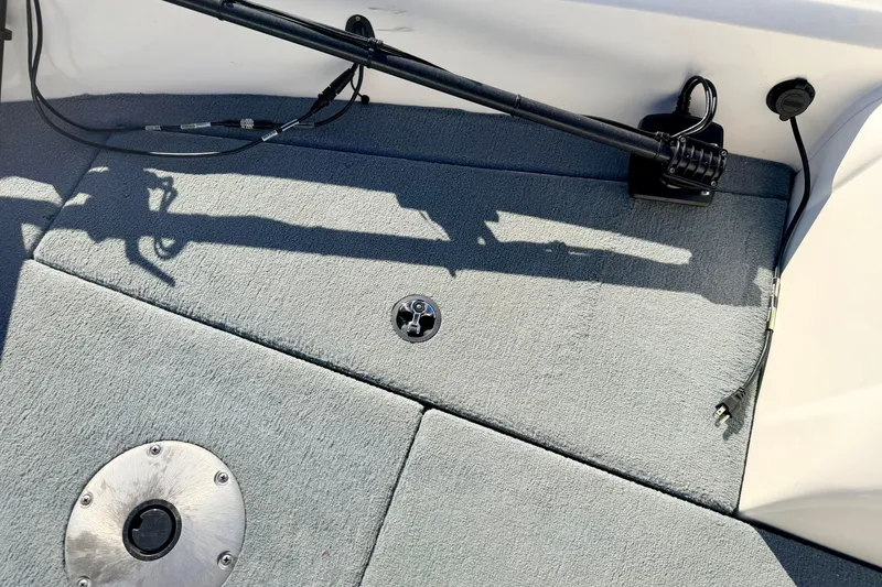 Slide: The Image of Interior of 2007 Stratos 375 XF boat with carpeted flooring and mounted equipment. - 62