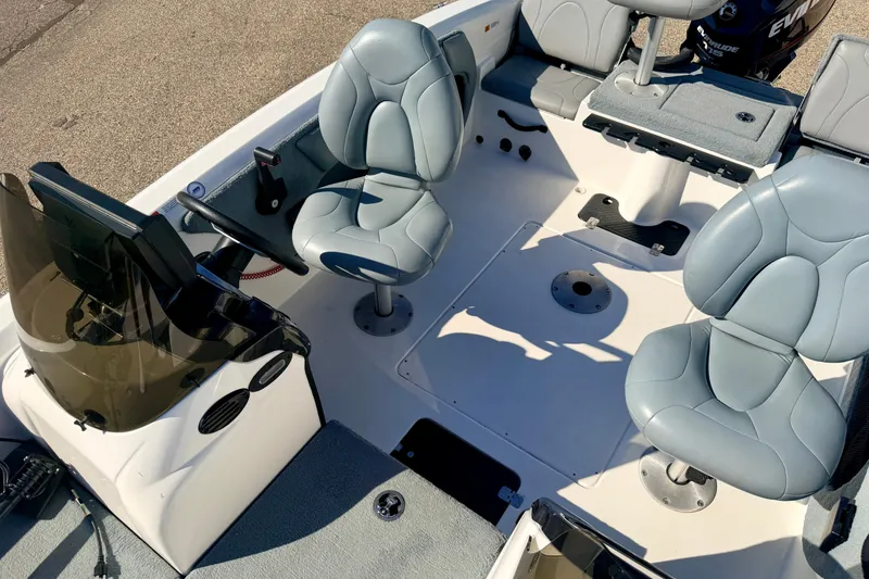 Slide: The Image of 2007 Stratos 375 XF boat interior with gray seating and steering console. - 75