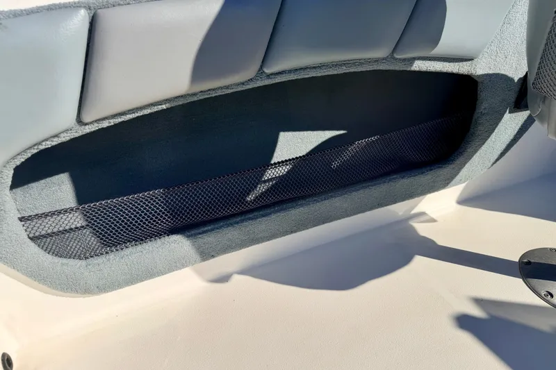 Slide: The Image of Interior storage compartment of a 2007 Stratos 375 XF boat with mesh netting. - 80