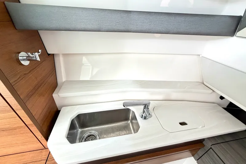 Slide: The Image of Modern sink area in 2020 Tiara Sport 34 LX boat interior. - 33