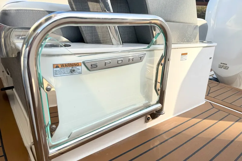 Slide: The Image of 2020 Tiara Sport 34 LX boat with sleek design and safety warnings. - 16