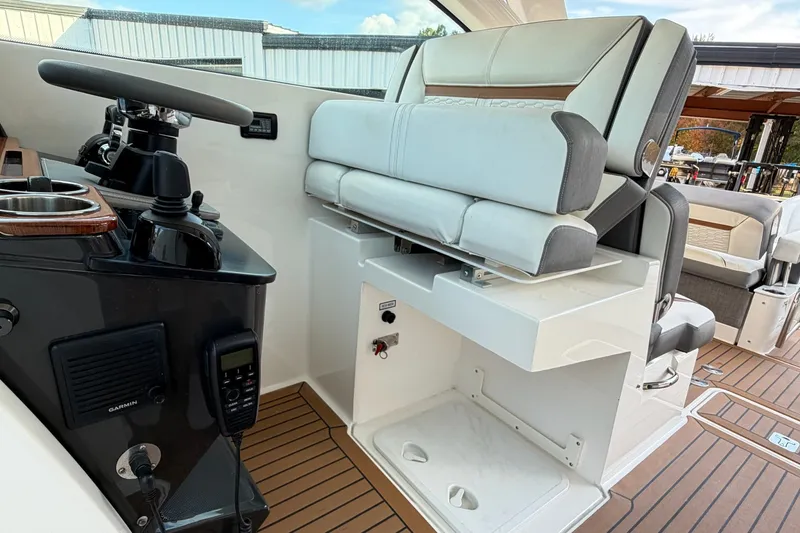 Slide: The Image of 2020 Tiara Sport 34 LX helm with modern controls and comfortable seating. - 26