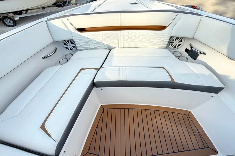 Slide: The Image of 2020 Tiara Sport 34 LX boat interior with white seating and teak flooring. - 41