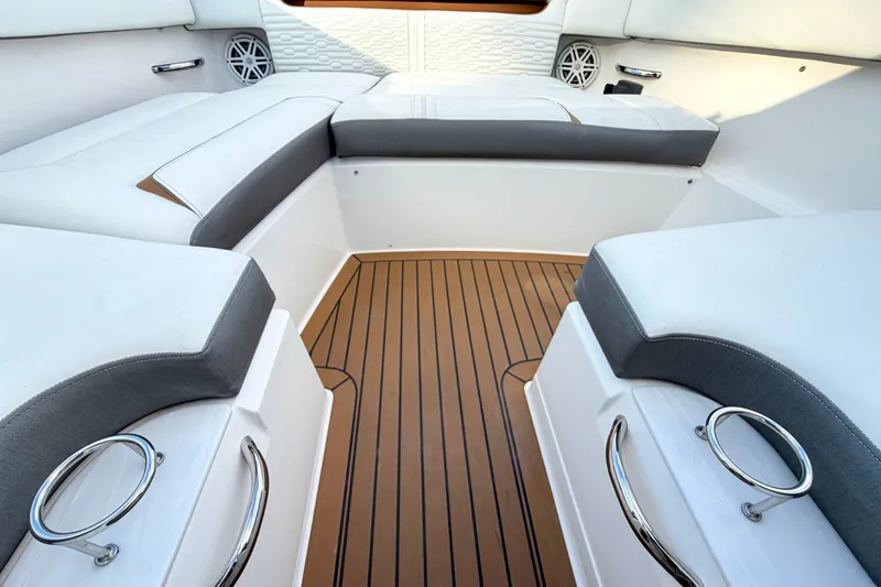 Slide: The Image of Luxurious interior of 2020 Tiara Sport 34 LX boat with cushioned seating and teak flooring. - 38
