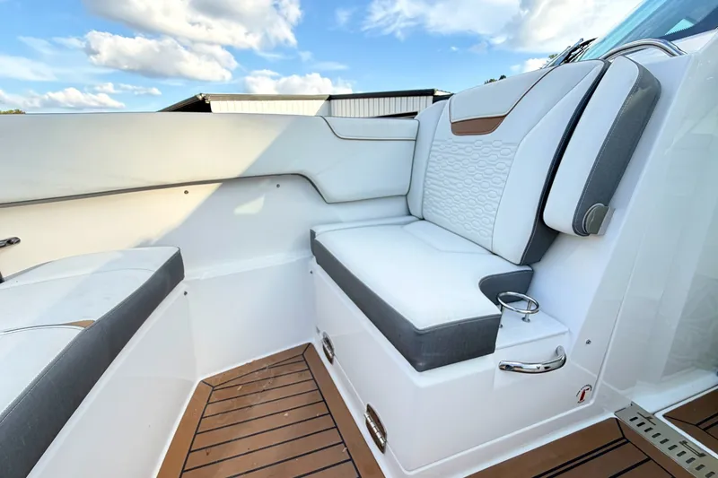 Slide: The Image of Luxurious seating on 2020 Tiara Sport 34 LX boat with elegant design and wooden flooring. - 40