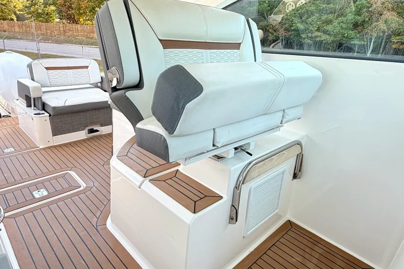 Slide: The Image of 2020 Tiara Sport 34 LX boat interior with luxurious seating and teak flooring. - 24