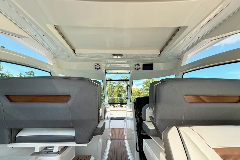 Slide: The Image of Interior view of 2020 Tiara Sport 34 LX boat, featuring modern seating and sleek design. - 22