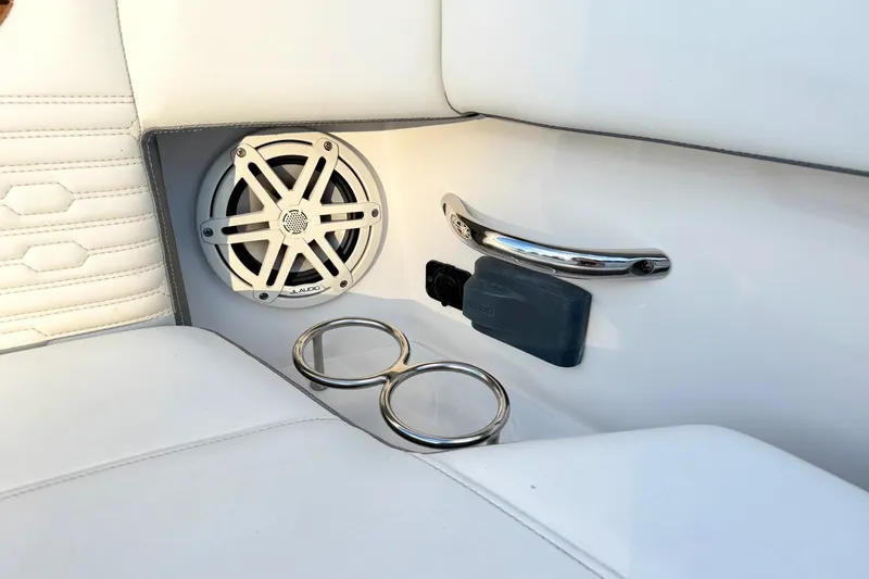 Slide: The Image of 2020 Tiara Sport 34 LX interior with speaker, cup holders, and handle. - 44