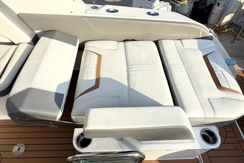 Slide: The Image of 2020 Tiara Sport 34 LX boat seating with white and gray upholstery. - 13