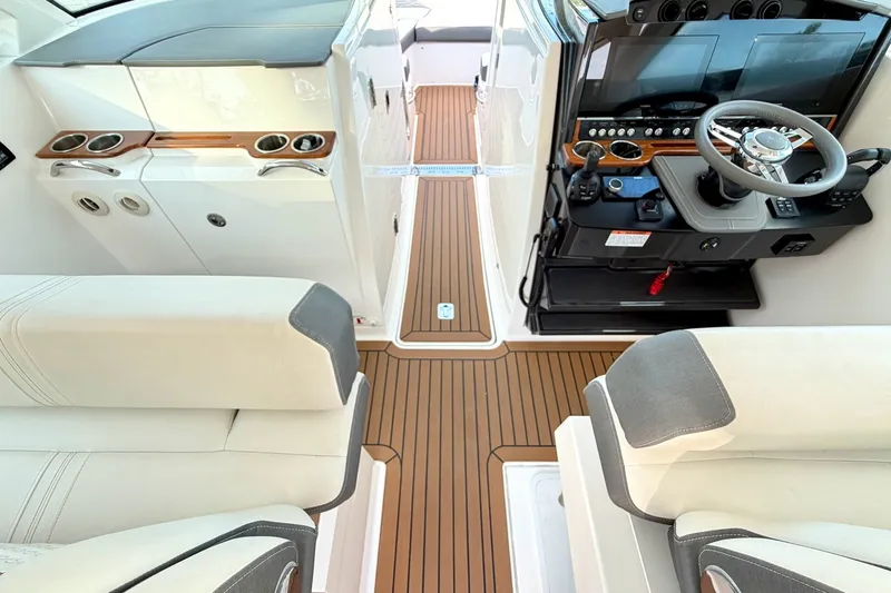 Slide: The Image of 2020 Tiara Sport 34 LX boat interior with modern helm and seating. - 23