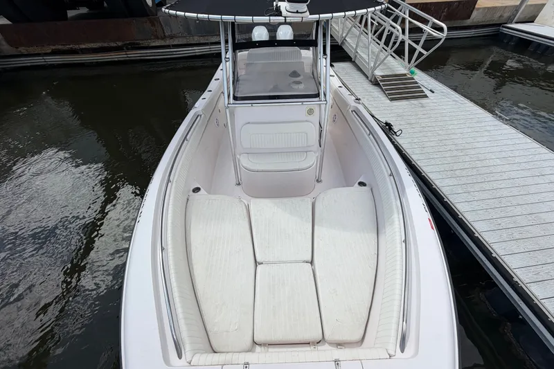 Slide: The Image of 2002 Grady-White Release 283 boat docked, featuring spacious seating and sleek design. - 17