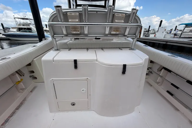 Slide: The Image of 2002 Grady-White Release 283 boat interior with rod holders and storage compartments at marina. - 5