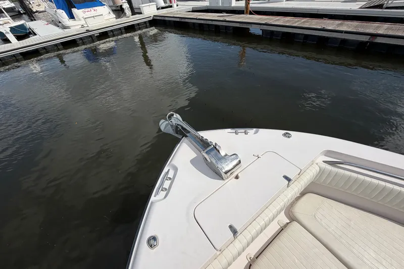 Slide: The Image of Bow of 2002 Grady-White Release 283 boat docked at marina. - 16