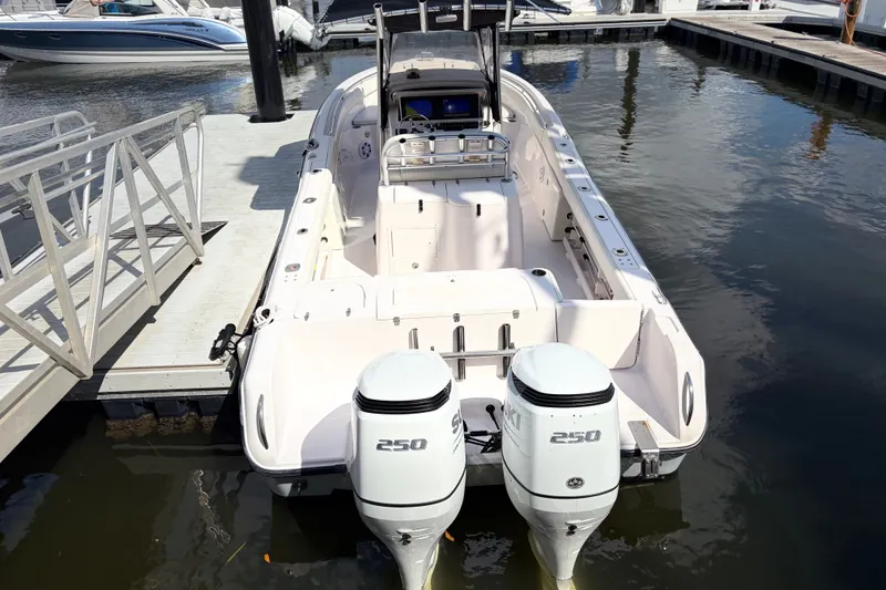 Slide: The Image of 2002 Grady-White Release 283 boat docked with twin 250 horsepower engines. - 3