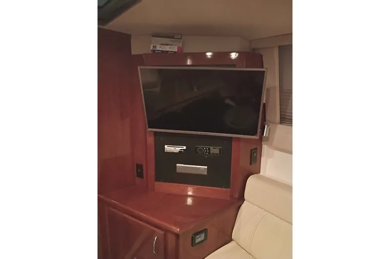 Slide: The Image of Entertainment system in 2003 Carver 350 Mariner yacht with mounted TV and audio controls. - 6