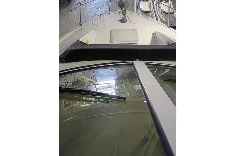 Slide: The Image of 2003 Carver 350 Mariner yacht, view from the bow in a marina setting. - 4