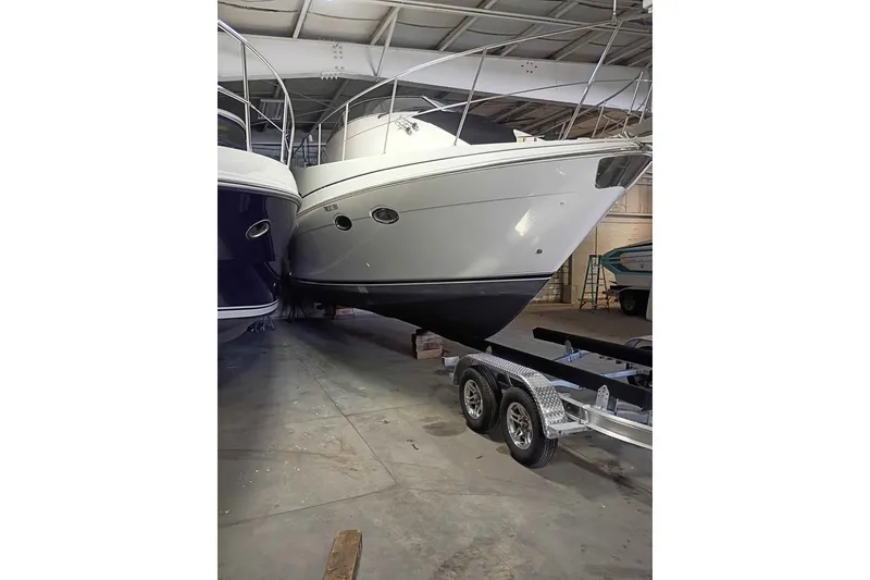 The Image of 2003 Carver 350 Mariner yacht on trailer in indoor storage facility. - 0