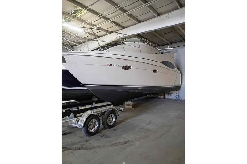 Slide: The Image of 2003 Carver 350 Mariner yacht in indoor storage on a trailer. - 1