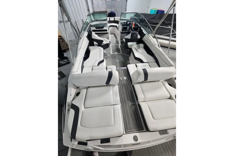 Slide: The Image of 2017 Regal 2300 Bowrider boat with spacious white seating and sleek interior design. - 3
