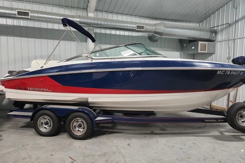 The Image of 2017 Regal 2300 Bowrider boat on trailer in indoor storage facility. - 0