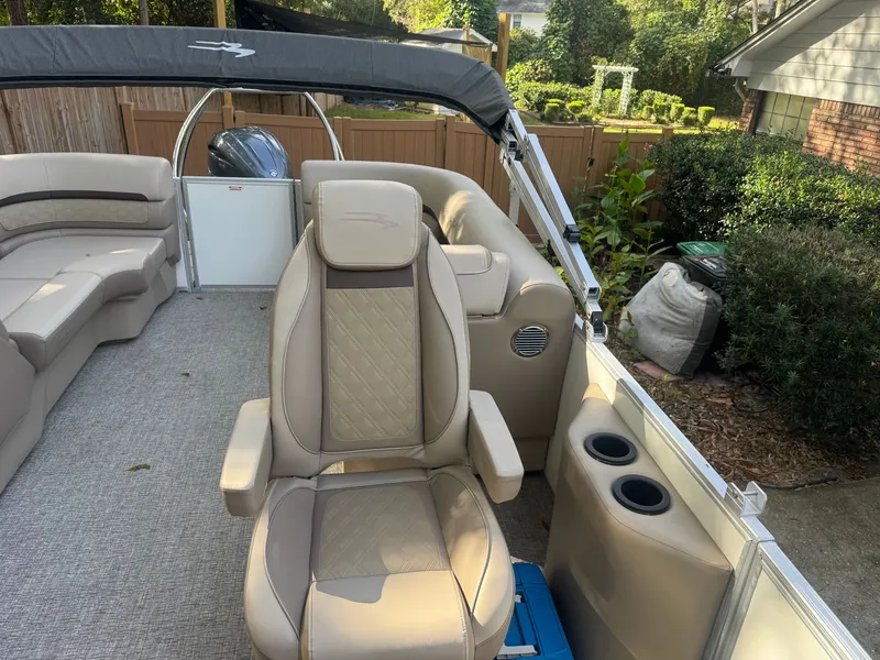 Slide: The Image of 2026 Bennington 22 SSRX with beige interior and comfortable seating. - 16
