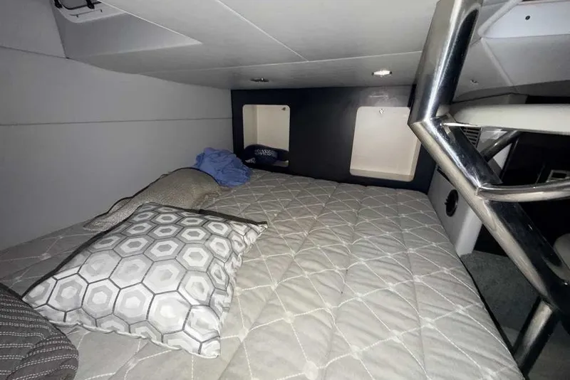Slide: The Image of 2019 Formula 350 Crossover Bowrider I/O cabin interior with bed and pillows. - 39