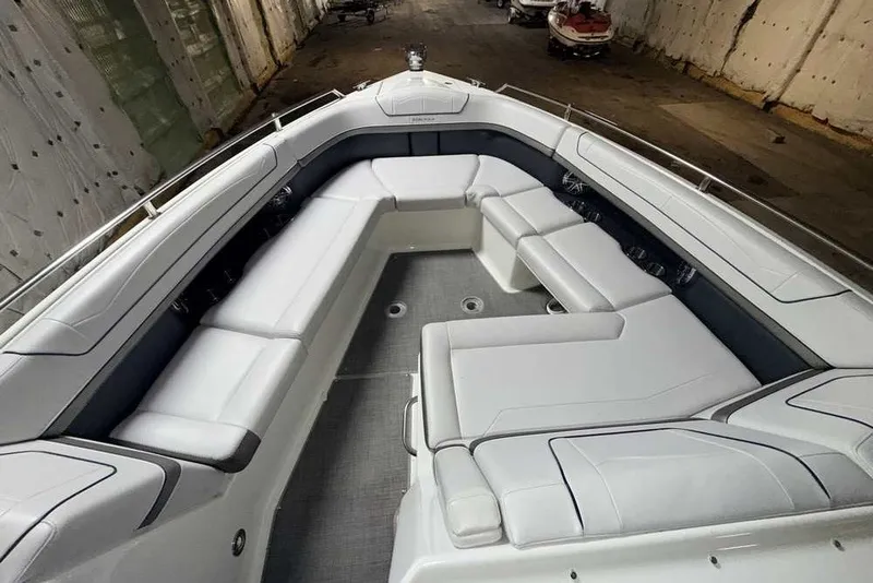 Slide: The Image of 2019 Formula 350 Crossover Bowrider I/O with spacious seating in a covered storage area. - 25