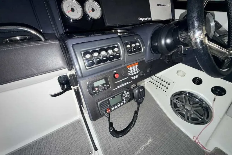 Slide: The Image of 2019 Formula 350 Crossover Bowrider I/O dashboard with controls and steering wheel. - 20