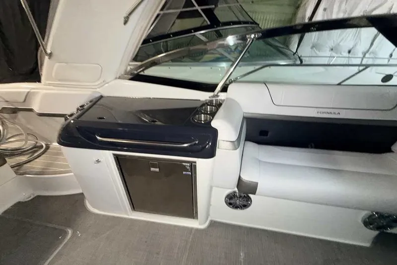 Slide: The Image of 2019 Formula 350 Crossover Bowrider I/O interior with seating and storage area. - 10