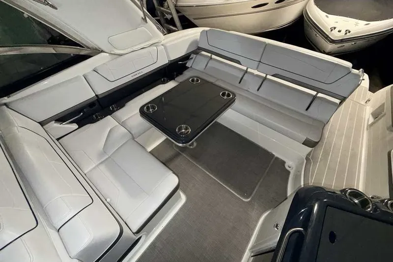 Slide: The Image of 2019 Formula 350 Crossover Bowrider I/O interior with spacious seating and table. - 7