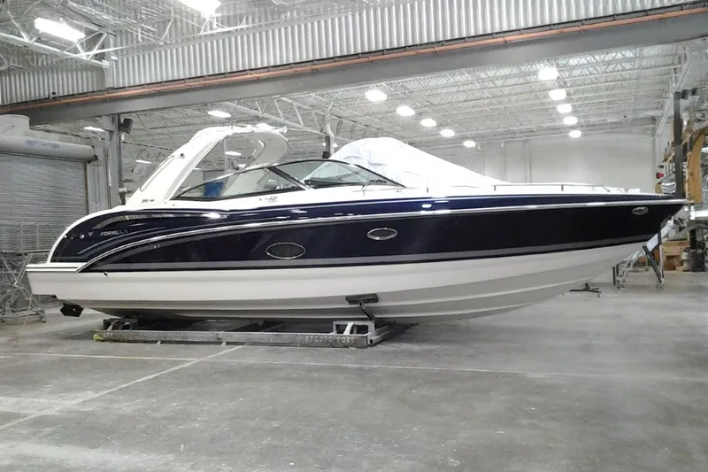 The Image of 2019 Formula 350 Crossover Bowrider I/O in a spacious indoor facility. - 0