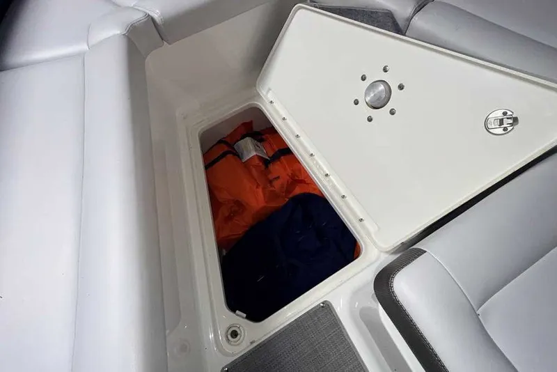 Slide: The Image of Storage compartment in 2019 Formula 350 Crossover Bowrider I/O with life jackets inside. - 30