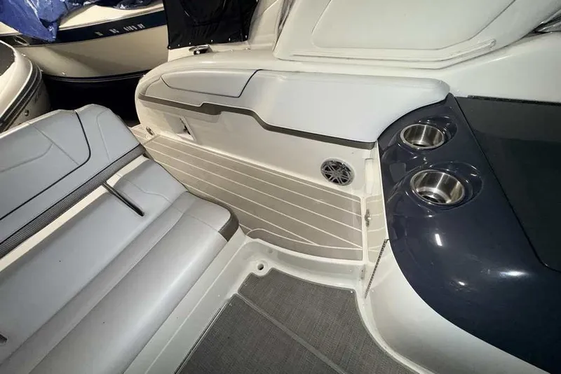 Slide: The Image of 2019 Formula 350 Crossover Bowrider I/O interior with seating and cup holders. - 9