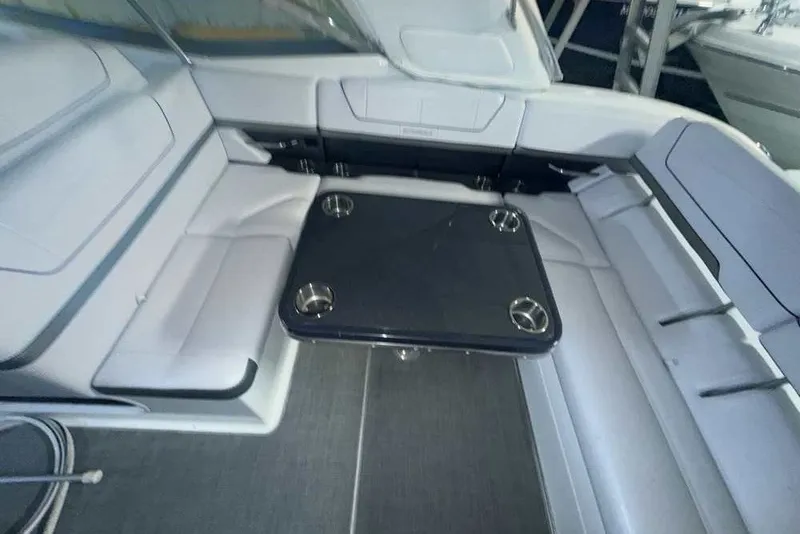 Slide: The Image of 2019 Formula 350 Crossover Bowrider I/O interior with seating and table. - 6