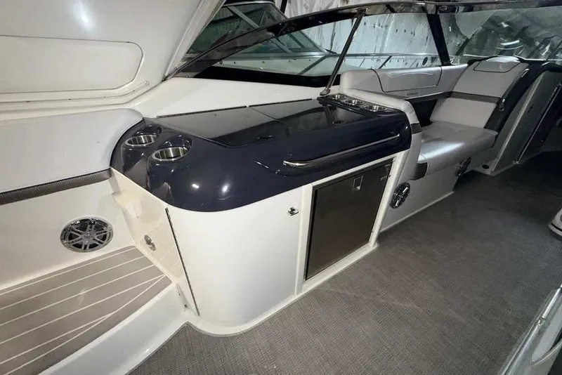 Slide: The Image of 2019 Formula 350 Crossover Bowrider I/O interior with seating and storage. - 11