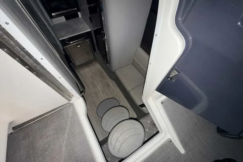 Slide: The Image of Interior view of 2019 Formula 350 Crossover Bowrider I/O, featuring compact cabin amenities. - 31