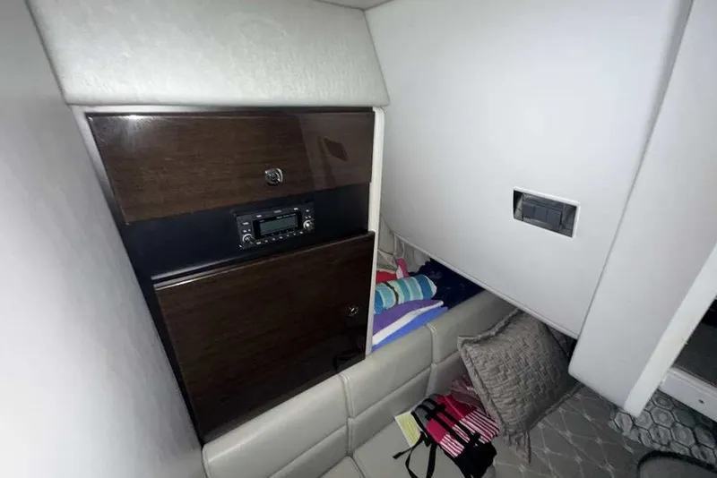 Slide: The Image of Interior cabin of 2019 Formula 350 Crossover Bowrider I/O with seating and storage. - 36