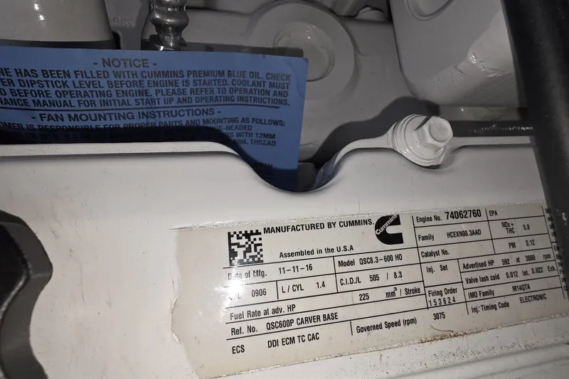 Slide: The Image of Engine label on a 2018 Carver C52 Coupe, manufactured by Cummins. - 54